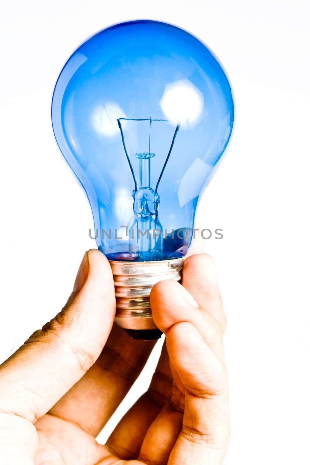 Blue light bulb in the hand, Isolated