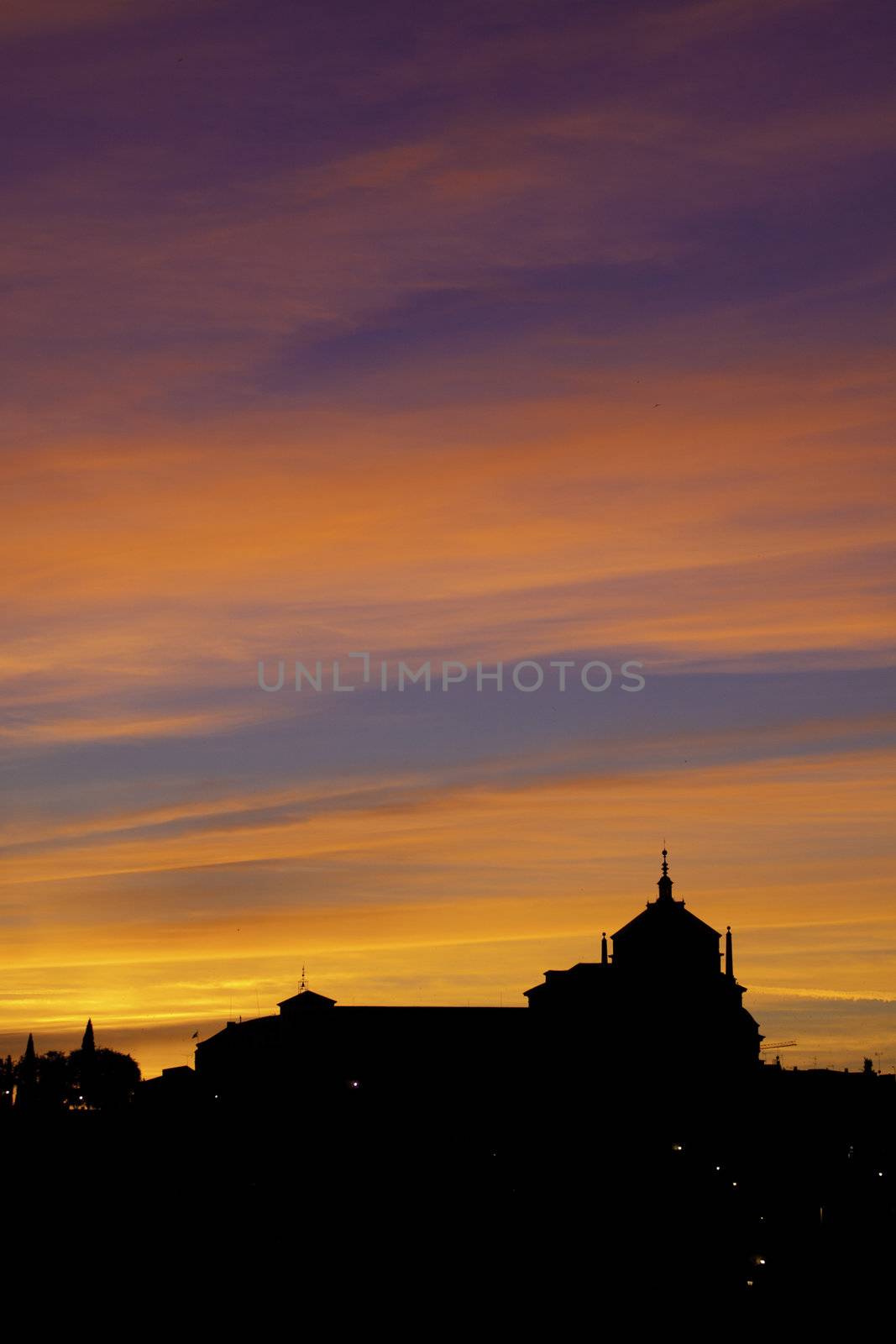 Silhouette of catholic church in sunset. by kasto