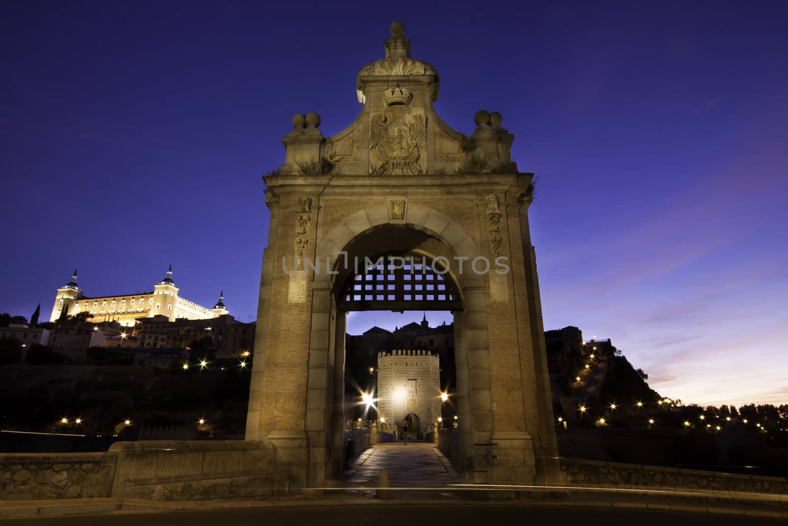 Alcazar of Toledo above the entrance to the medieval San Martin bridge - Castilla la Mancha, Spain