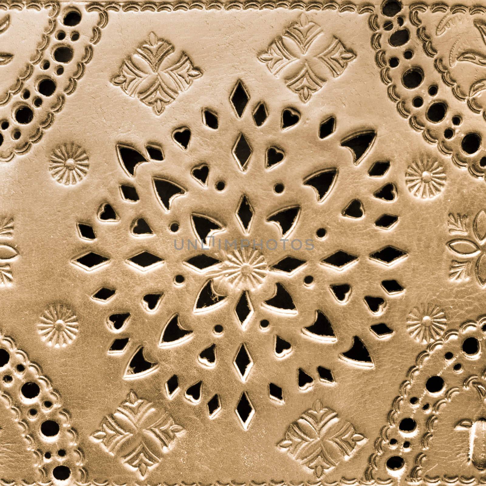 Arabic handicraft product pattern craftet in a golden leather.