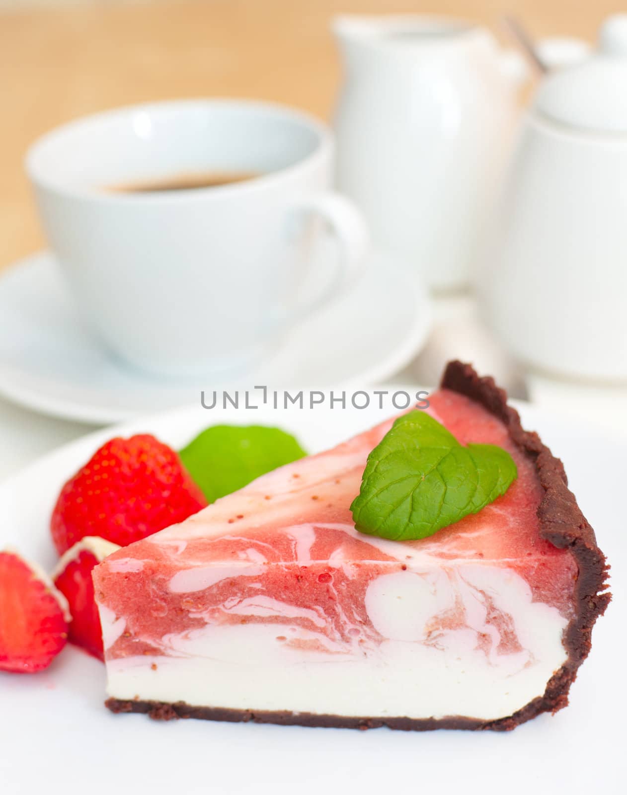 Homemade Strawberry Cheesecake and Espresso Coffee on The Table