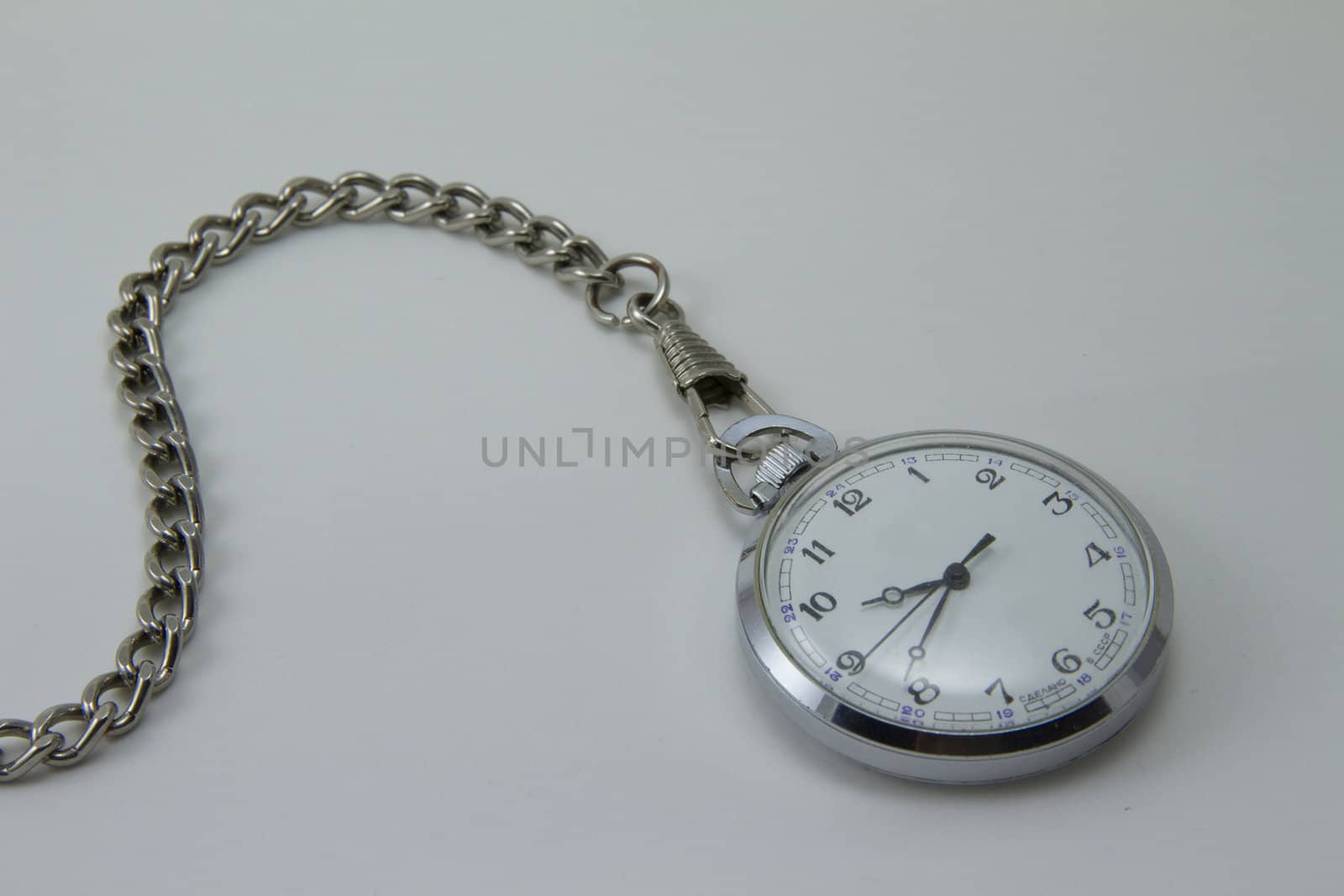 Old pocket watch with a chain
