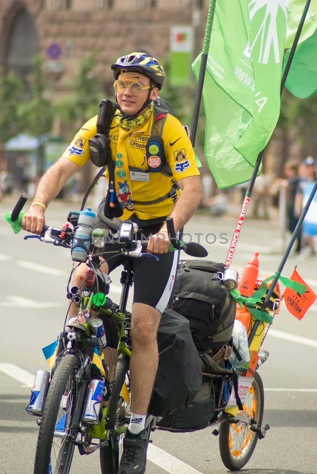 The traveler going on a bike on a street