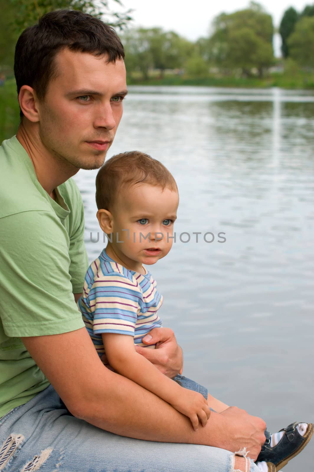 Portrait of father and son near the river
