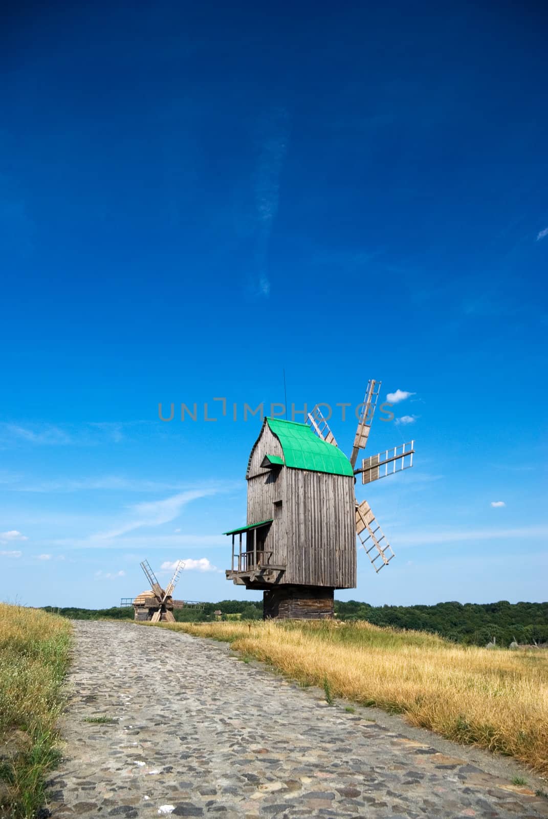 Old wooden windmills by vrvalerian