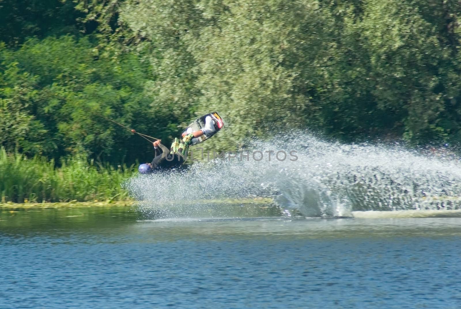 Young man wakeboarding on the lake