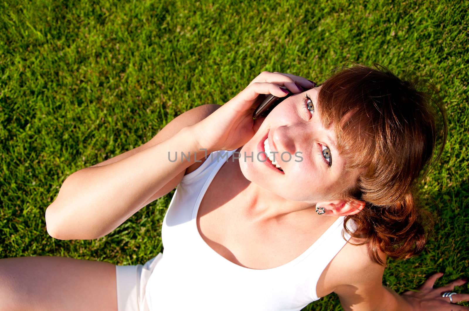 portrait of young woman talking on cell by adam121