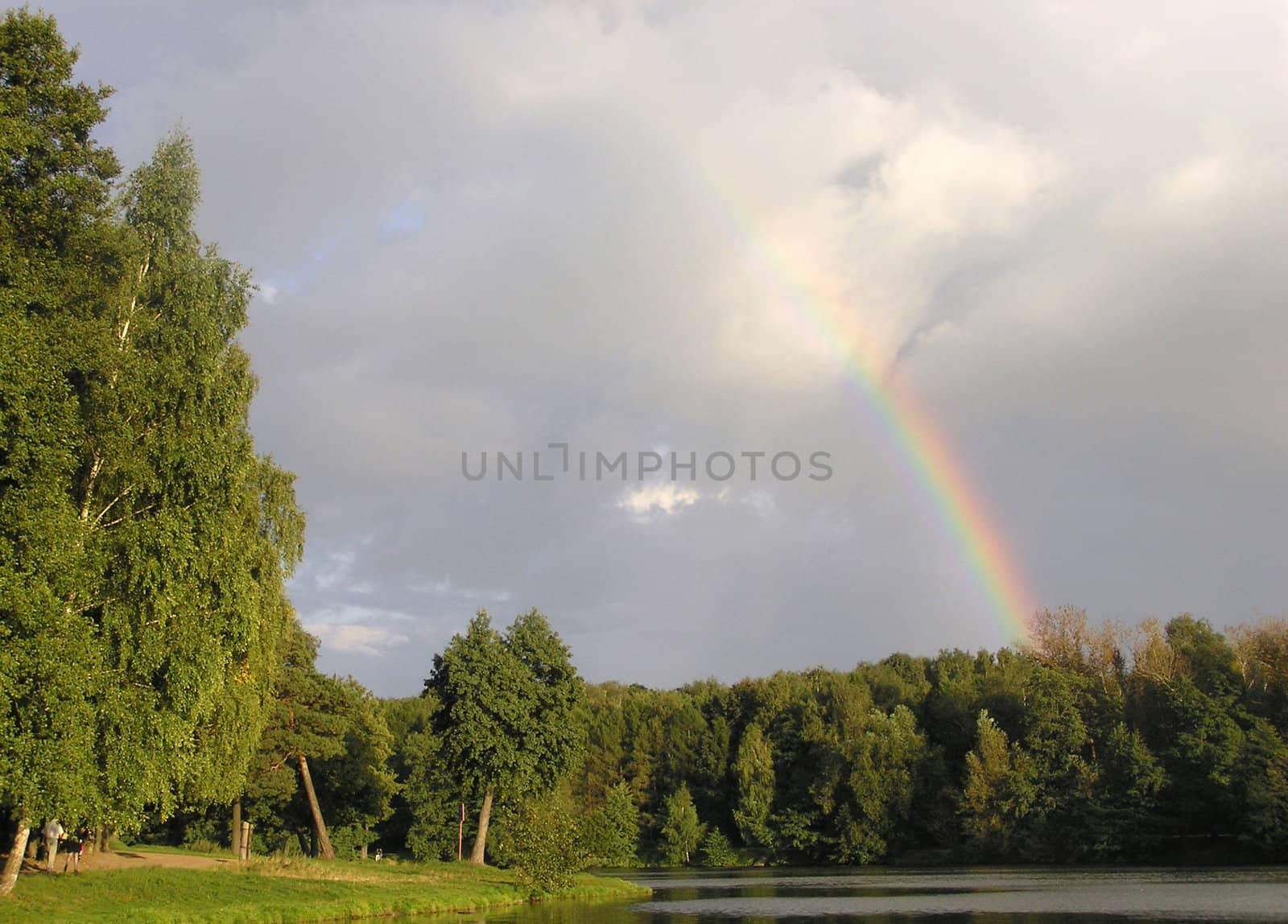Rainbow after a thunderstorm in a Moscow park       