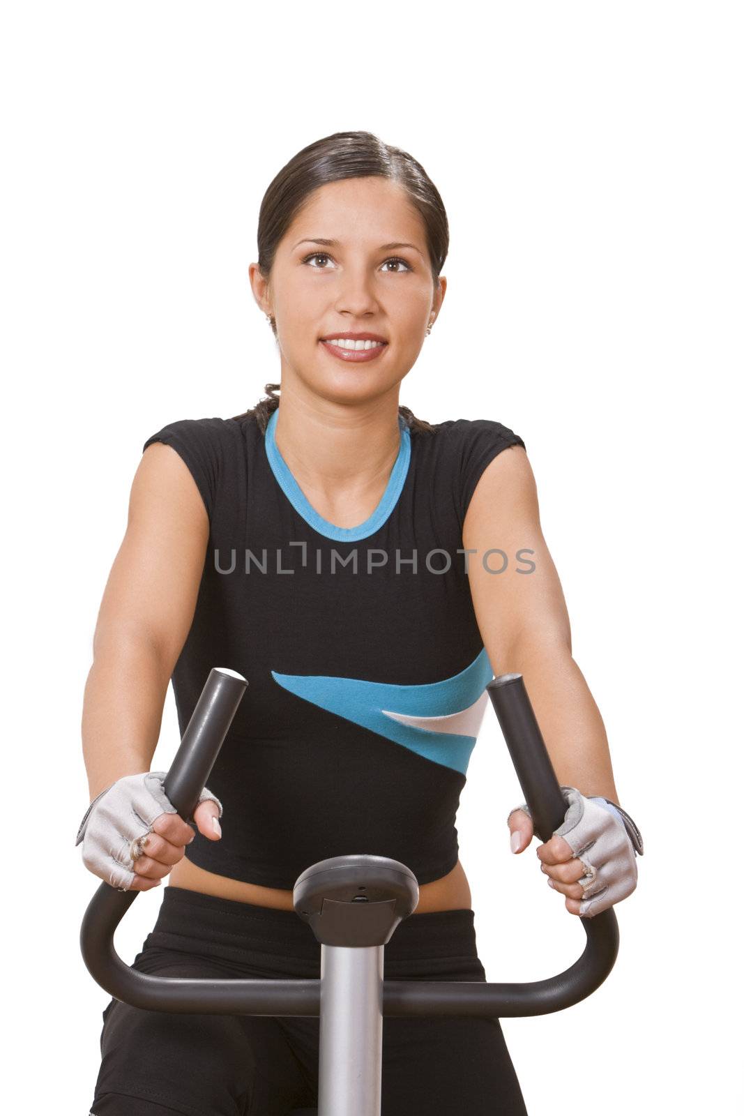 Portrit of a girl riding a fitness bicycle.
