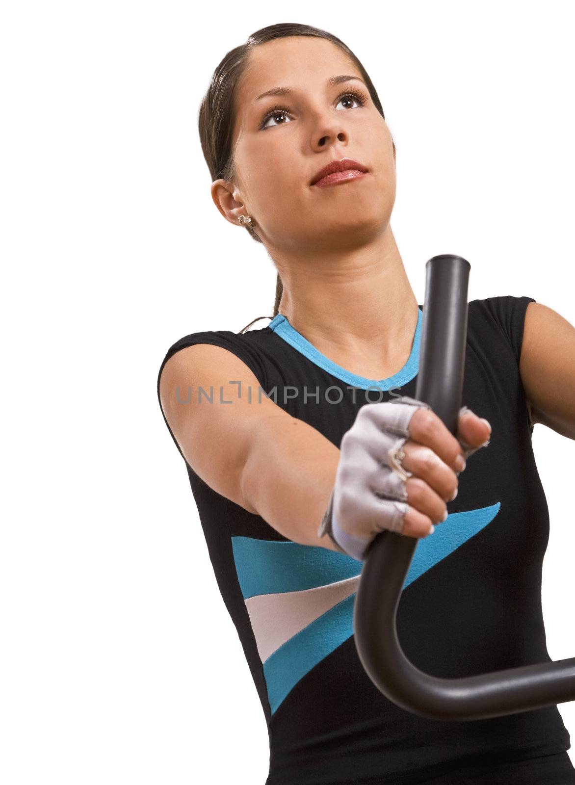 Portrait of a girl riding a fitness bicycle.