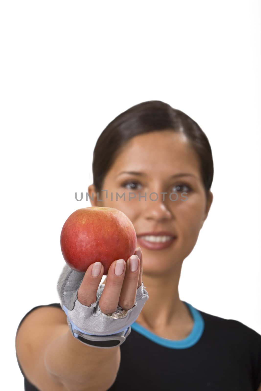 Young sportsgirl offering a red apple-a suggestion for healthy eating.