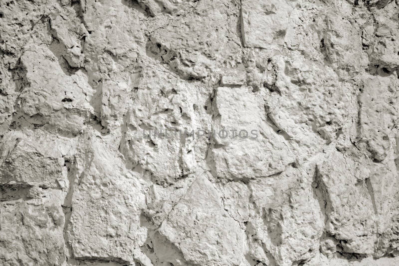 The close-up of a white stone wall for texture or background
