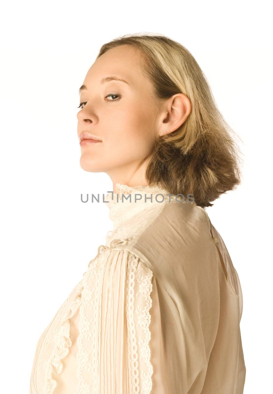 The portrait of a woman looking coldly back over her shoulder
