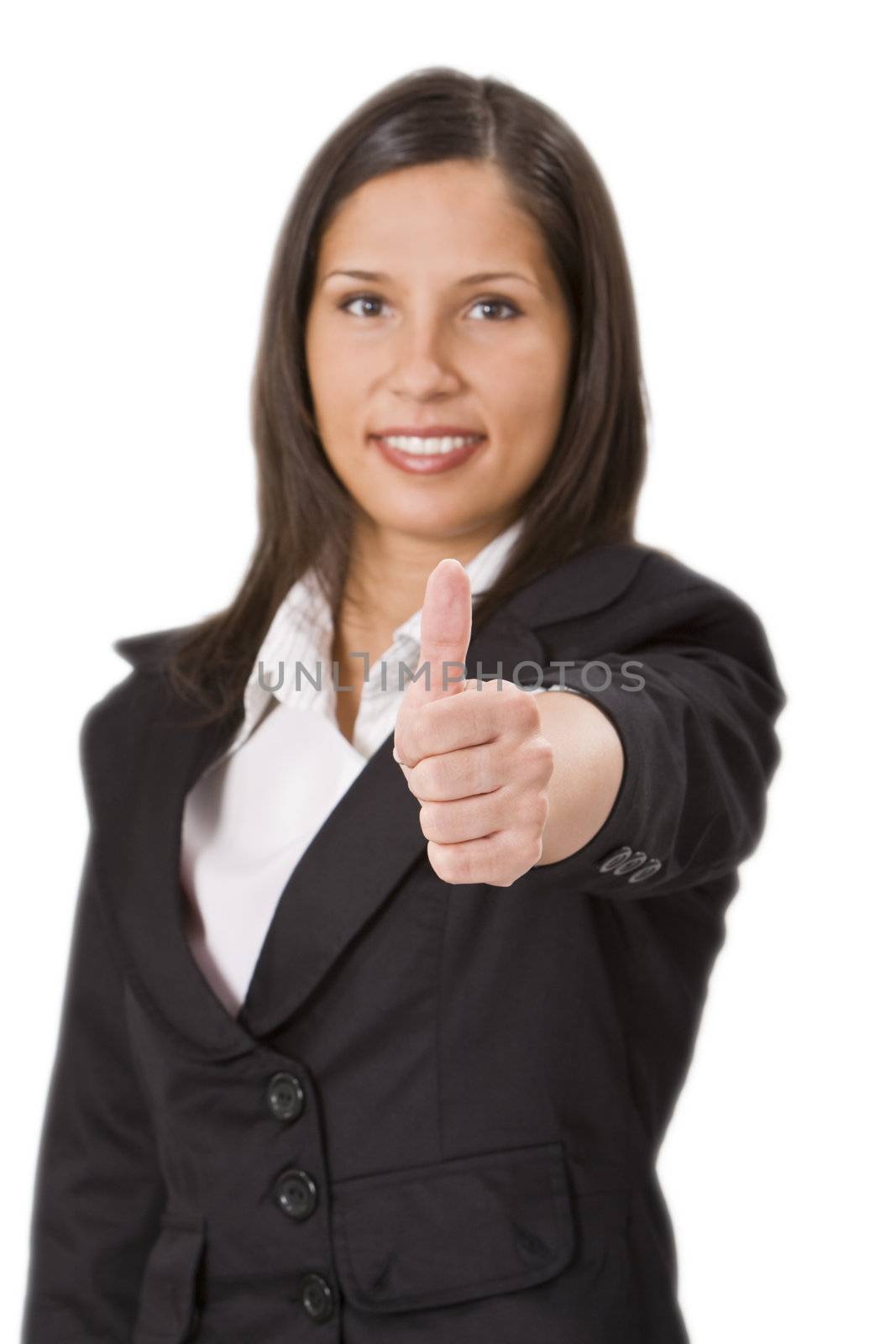 Businesswoman making a characteristic thumb-up gesture - selective focus on the hand.