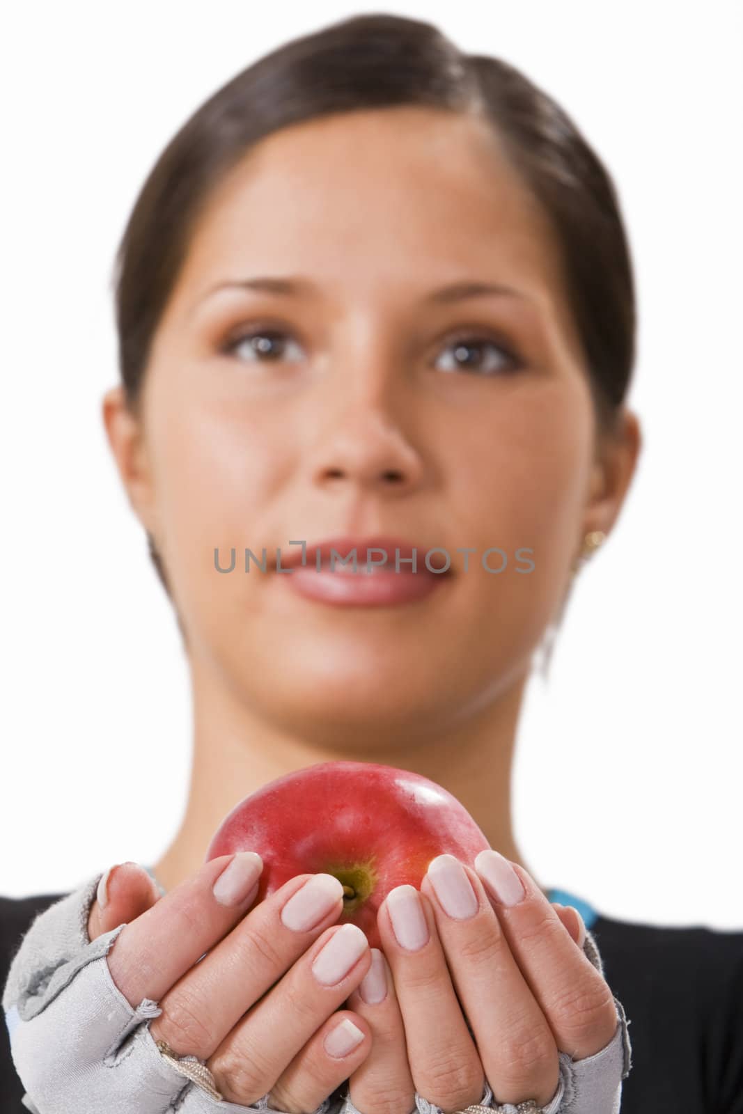 Girl offering a red apple.Selective focus on the apple.
