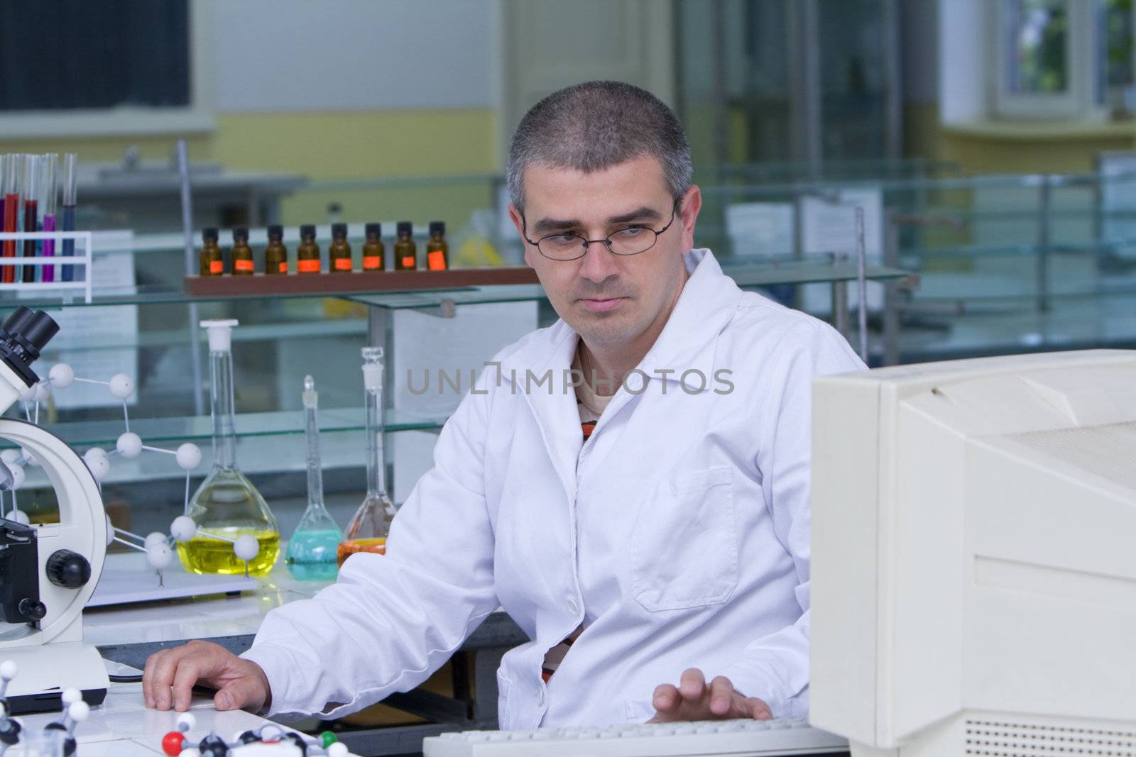 A researcher checking data on the computer computer at his workplace.