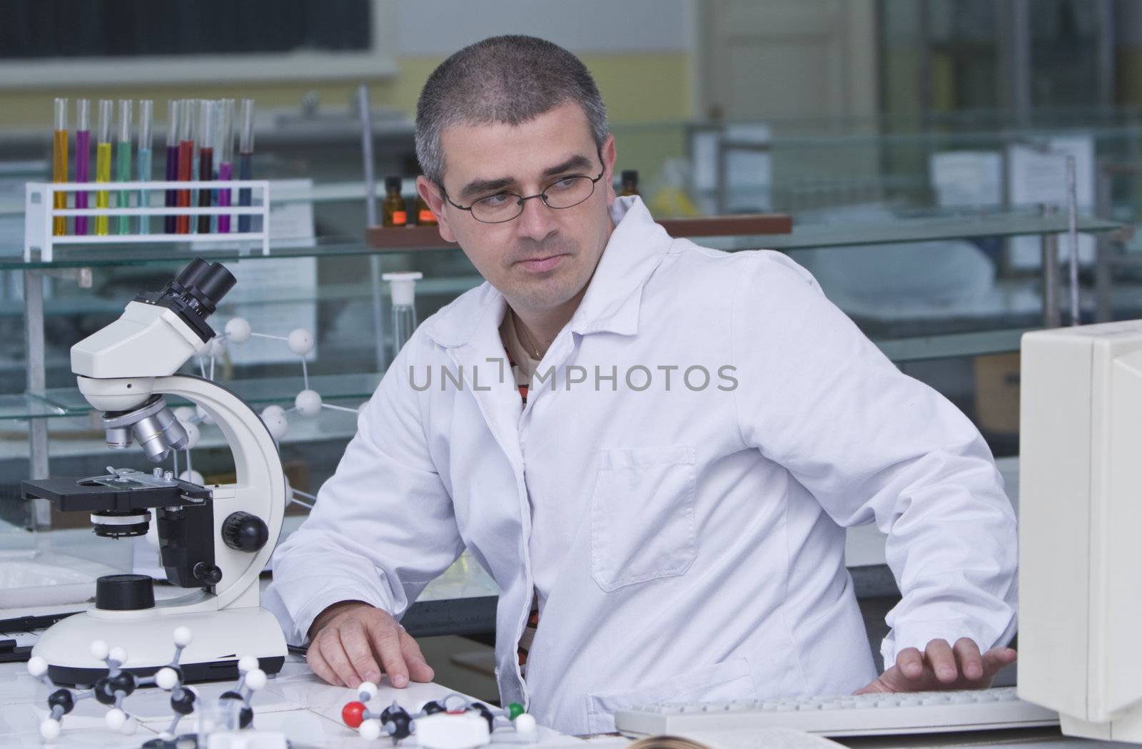 A researcher checking data on the computer computer at his workplace.