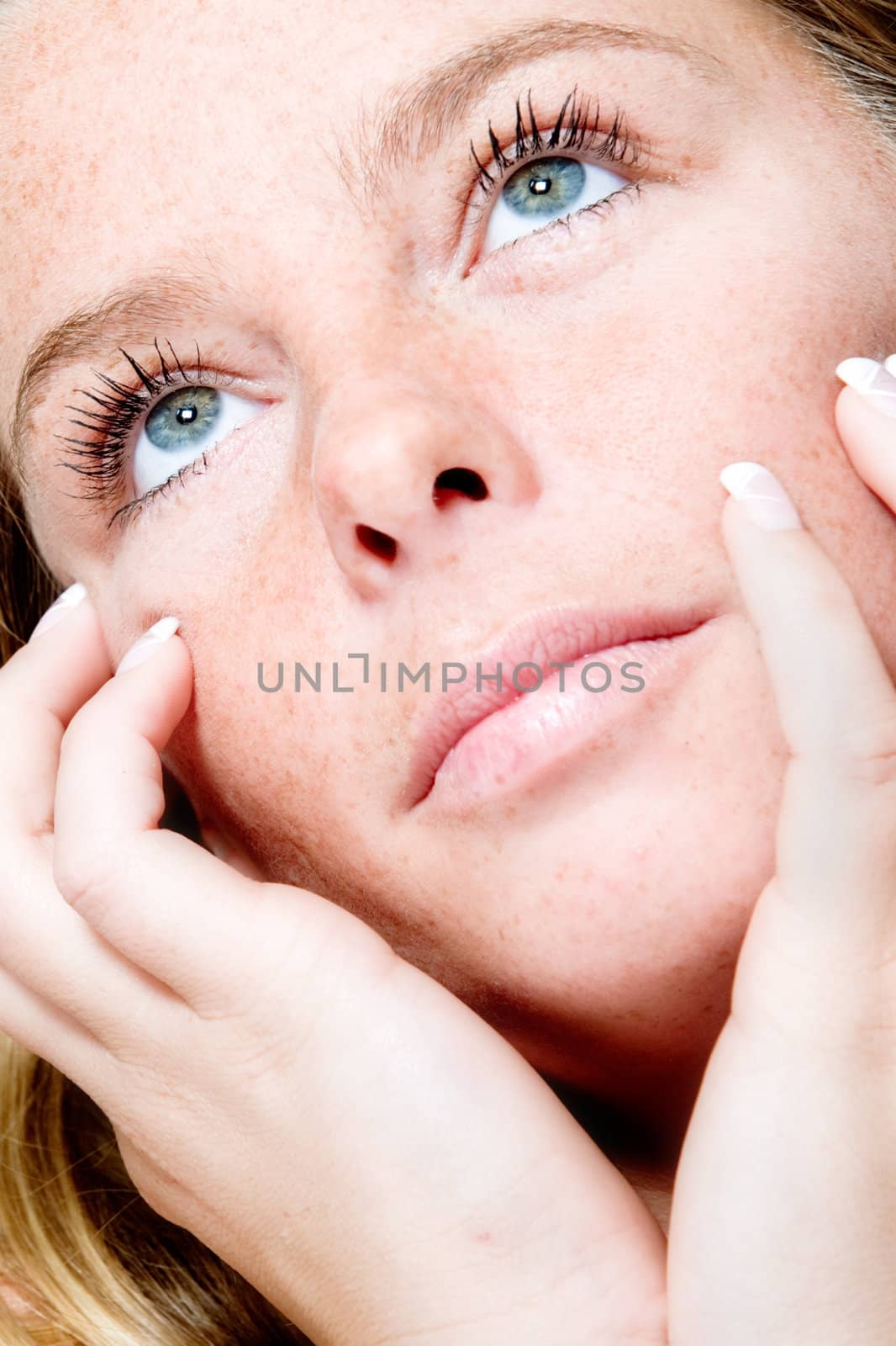 Studio portrait of a beautyfull blond model looking up