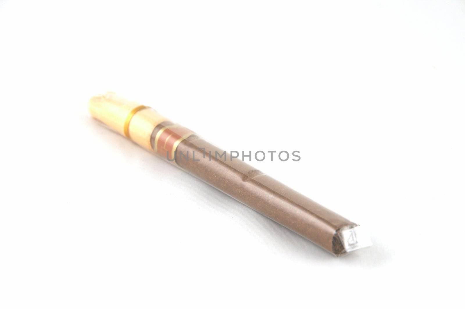 A cigar in polyethylene packing on a white background