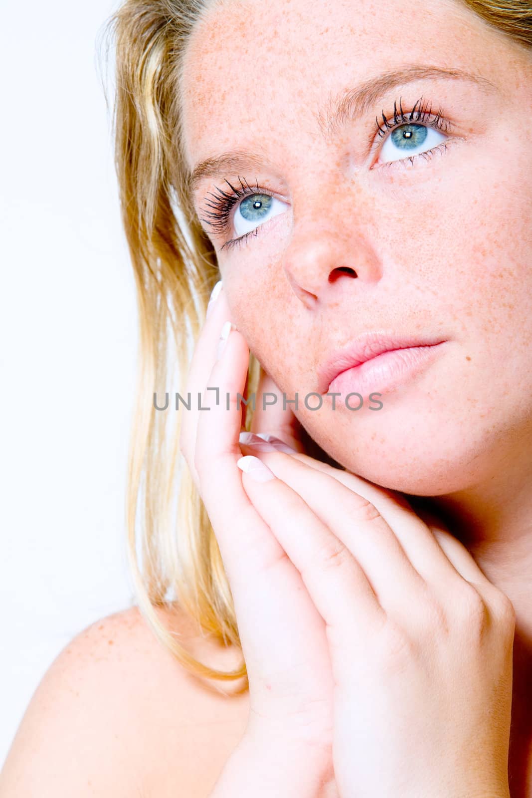 Studio portrait of a beautyfull blond model looking up