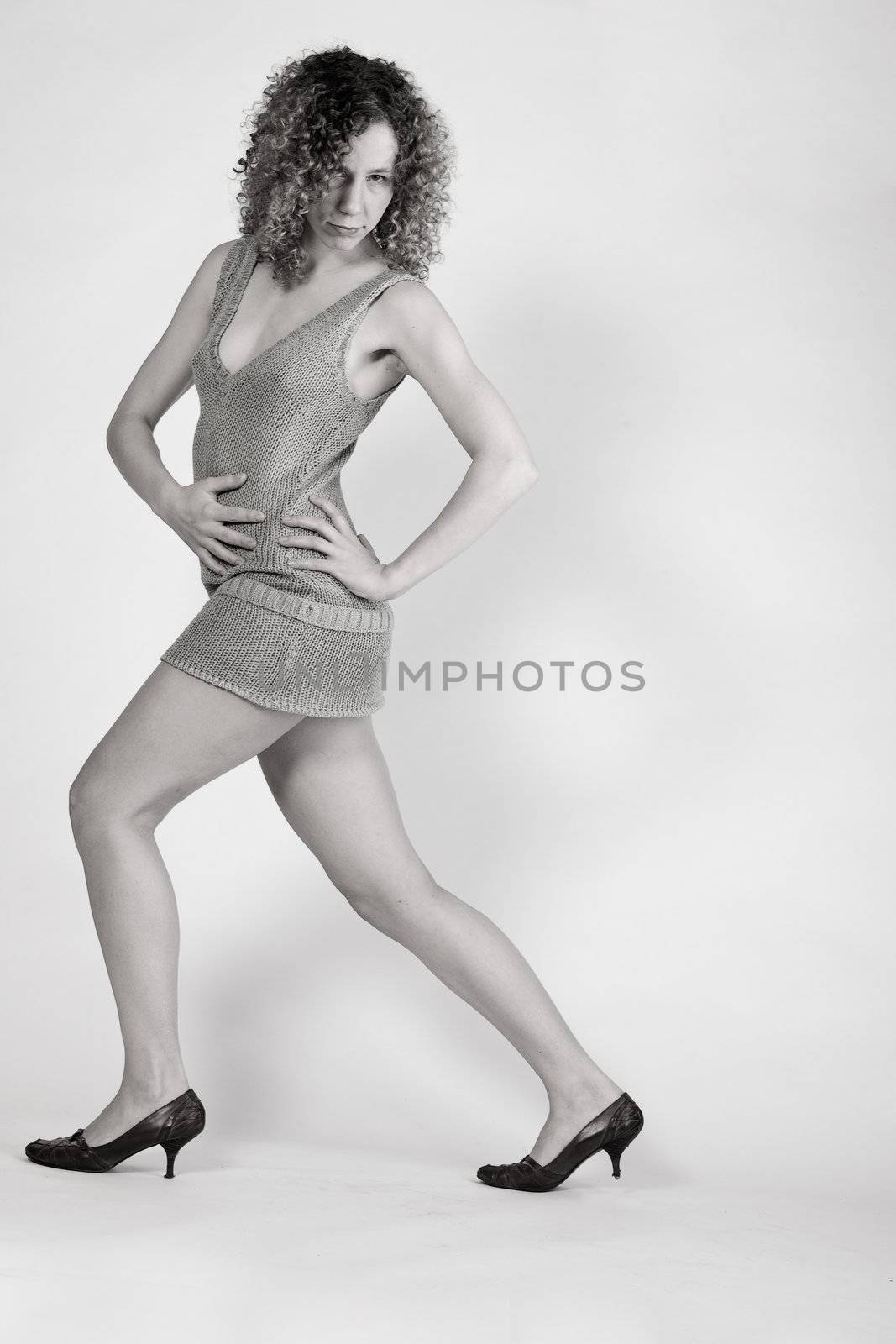 model who takes a fashion pose in the studio