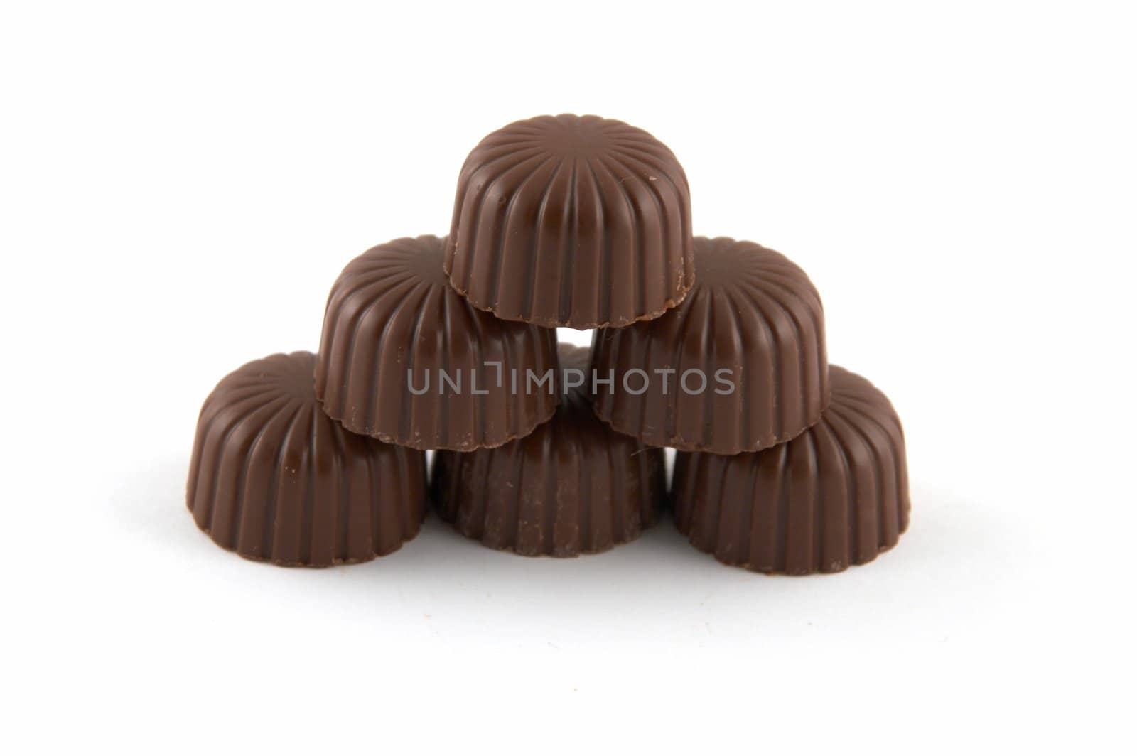 Sweets chocolate with a stuffing, on a white background