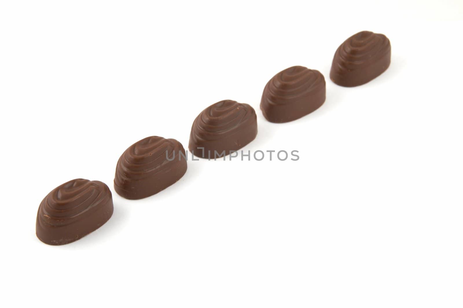 Sweets chocolate with a stuffing, on a white background