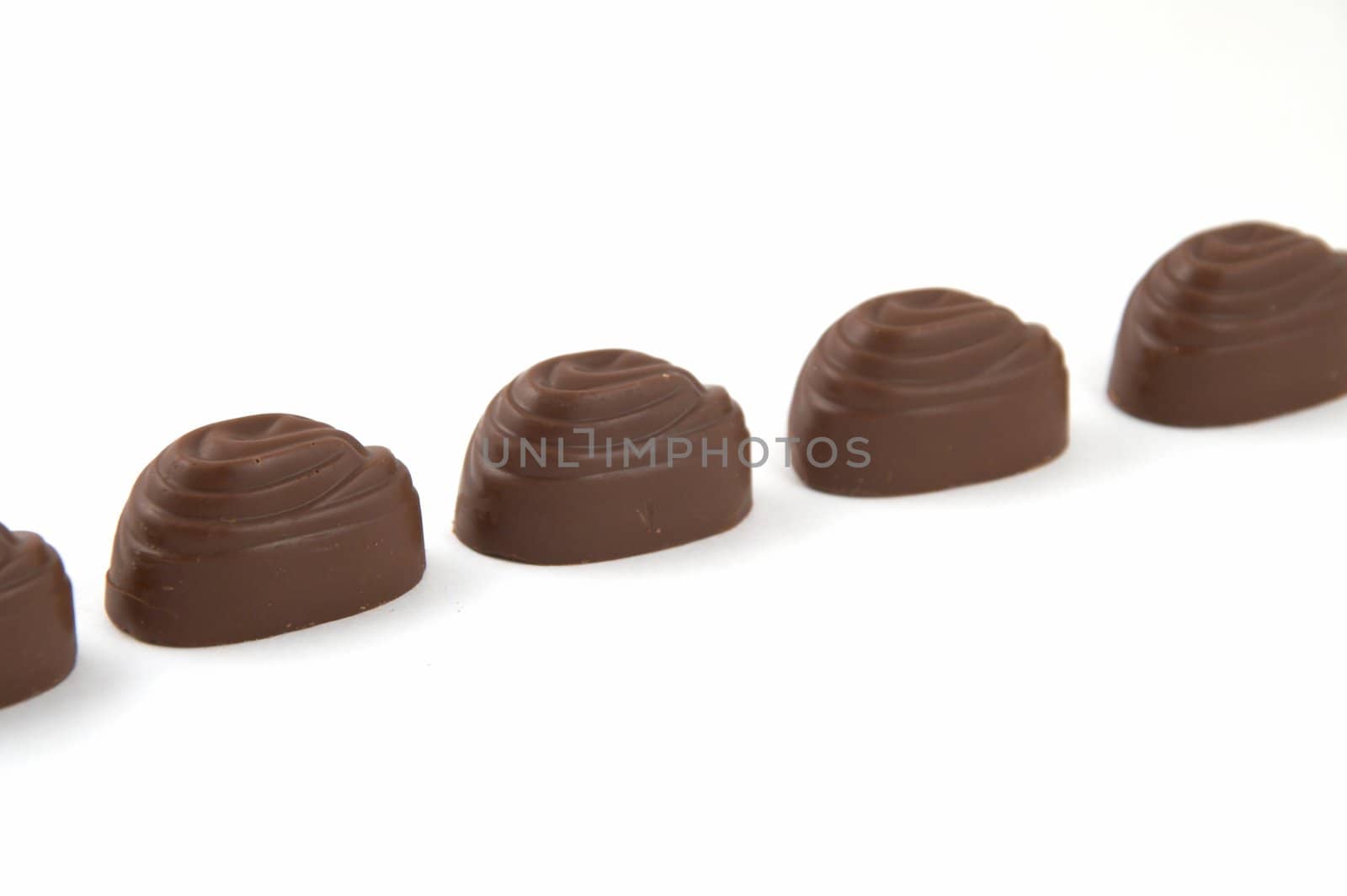 Sweets chocolate with a stuffing, on a white background