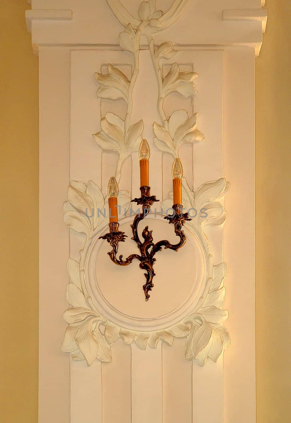 The image of illumination on a moulding of Baroque made in ancient style