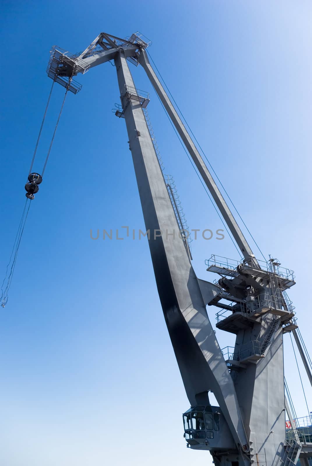 big harbor crane in the background of blue sky