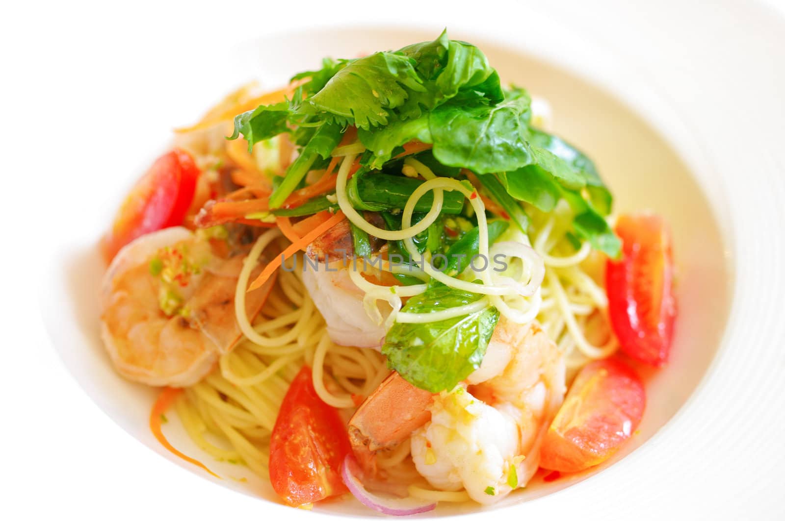 Spaghetti with shrimp on white background