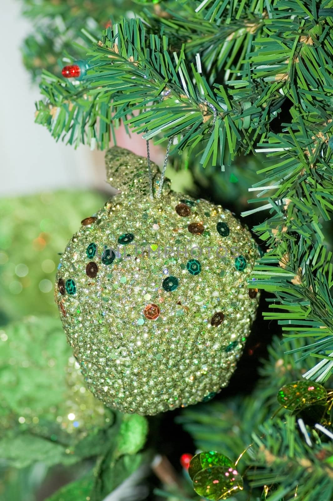 Glass Christmas decoration on a green tree 