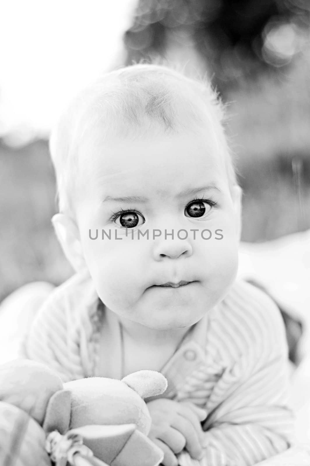 cute baby's portrait. outdoor shot. black and white photography.