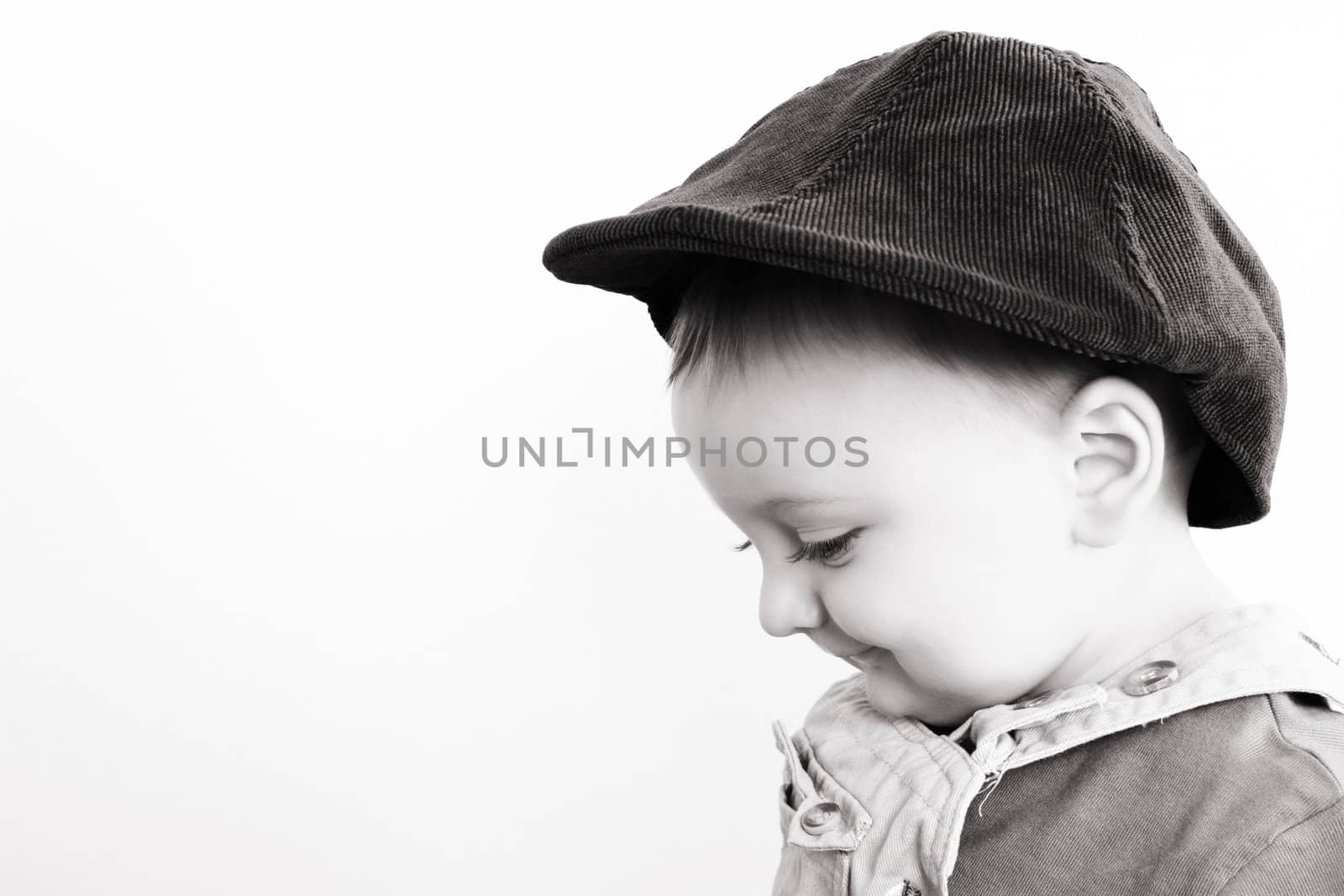 Adorable baby boy wearing a stylish hat