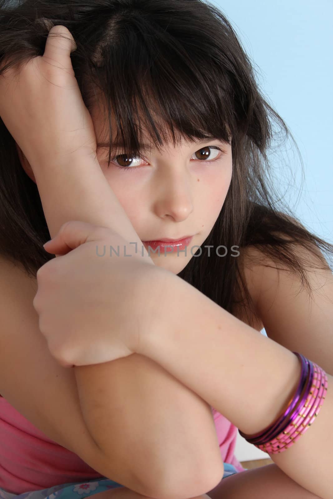 Beautiful brunette teen with a serious facial expression