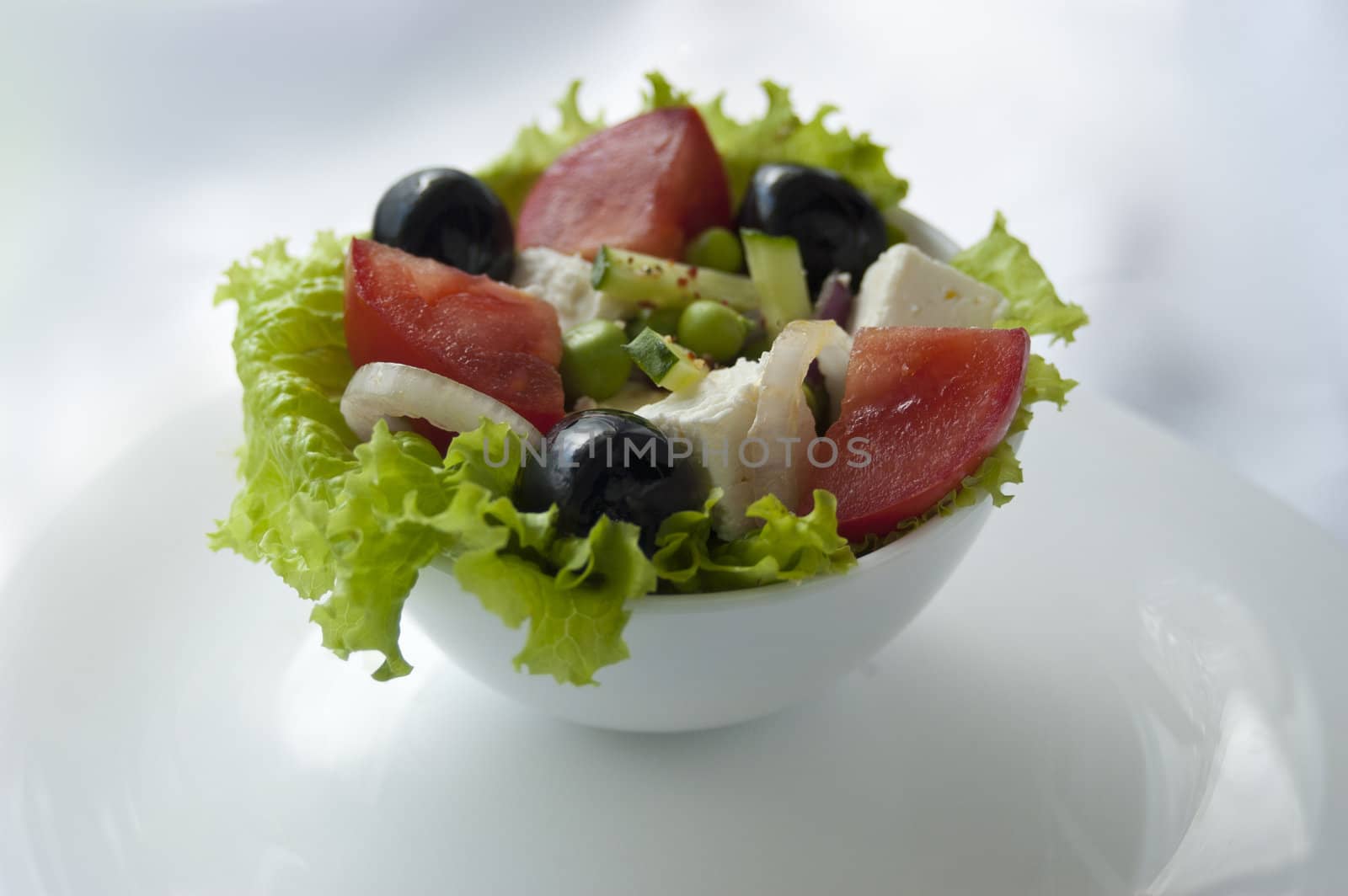 greek salad in the white plate