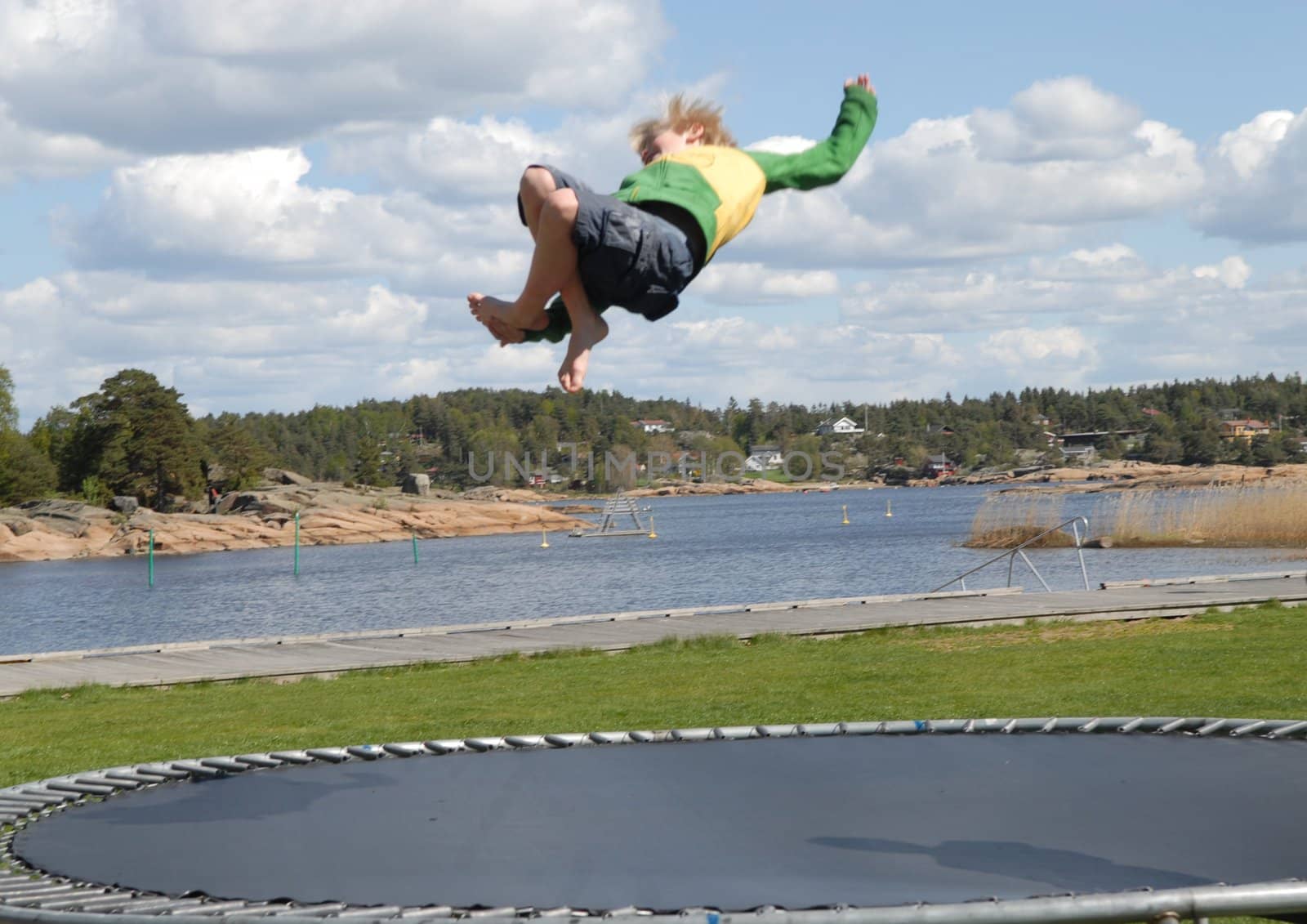 boy playing on the trampoline. Please note: No negative use allowed.