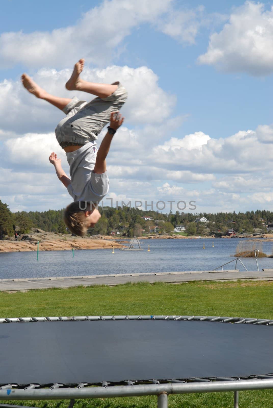 boy playing on the trampoline. Please note: No negative use allowed.