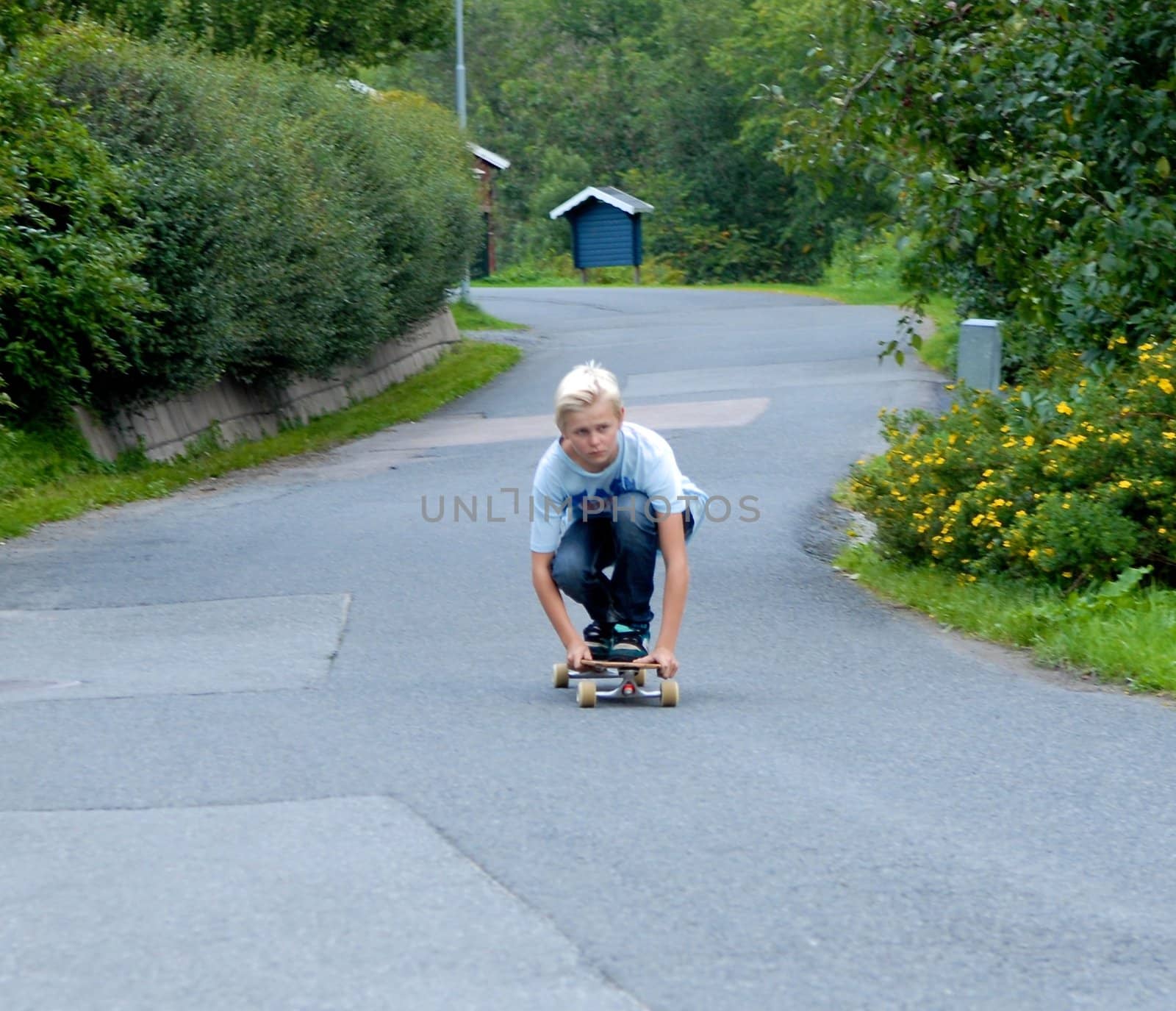 a boy practising skate board. Please note: No negative use allowed.