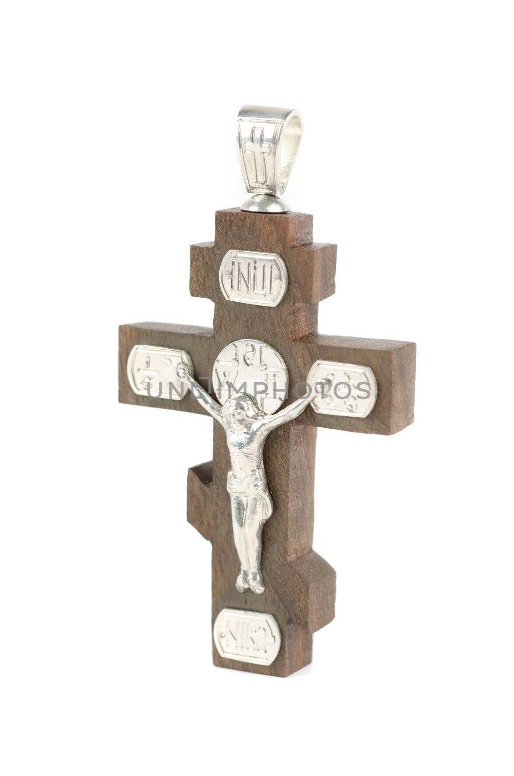 silver and wooden cross with religious inscriptions isolated on a white