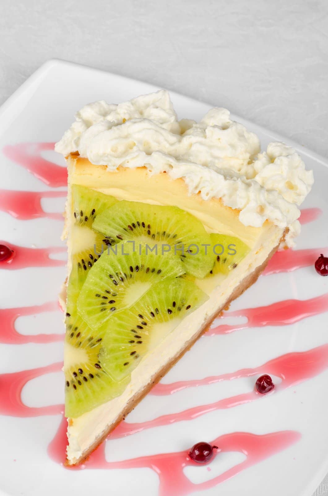 tasty kiwi fresh cake closeup at plate