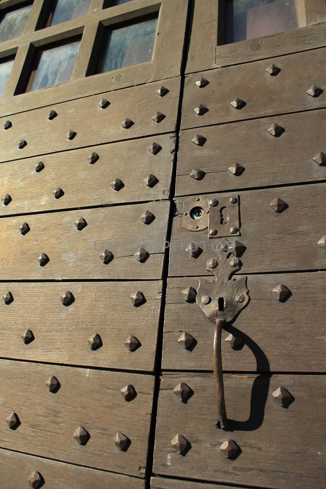 Close up of an old door made of brown wood