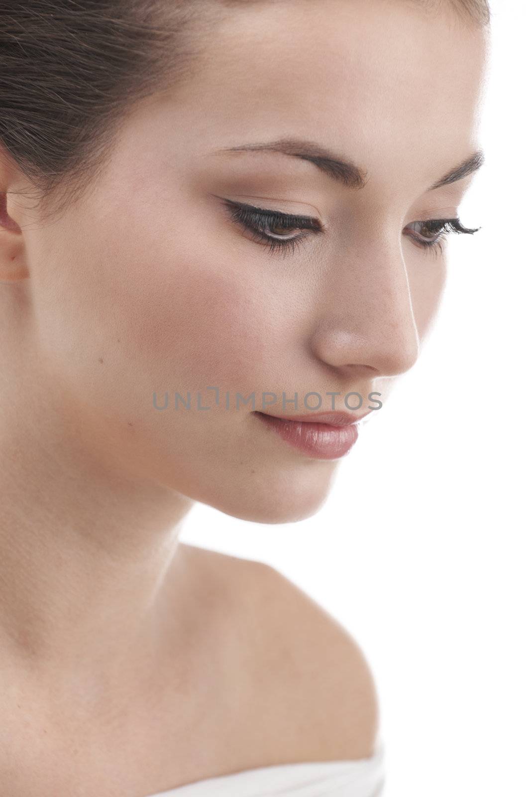 Young womans face with subtle make up and eye lash extensions