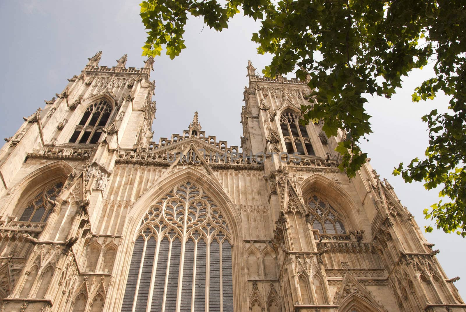 A View of the West Entrance of York Minster Yorkshire England under a blue sky