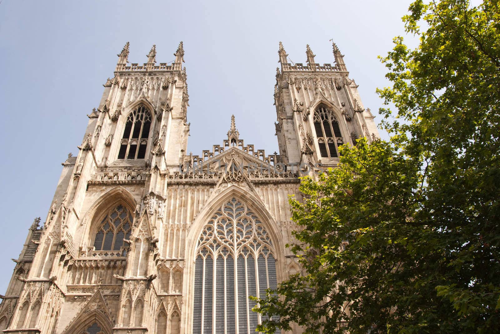 A View of the West Entrance of York Minster Yorkshire England under a blue sky
