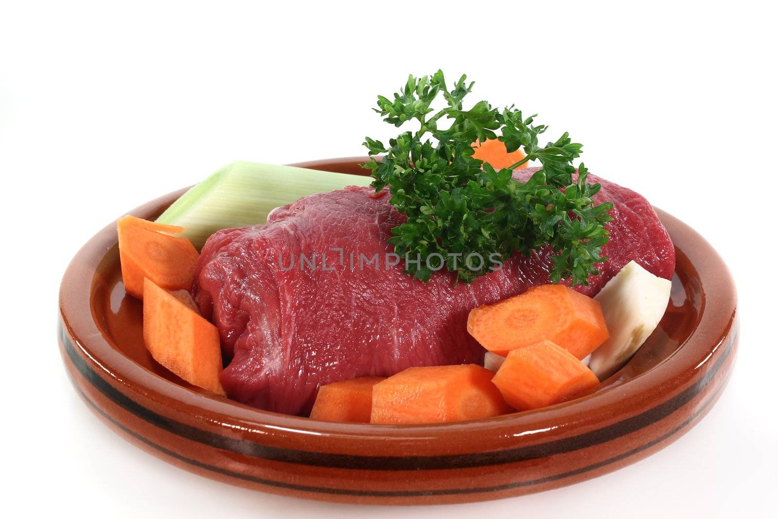 raw beef with vegetables in a tajine