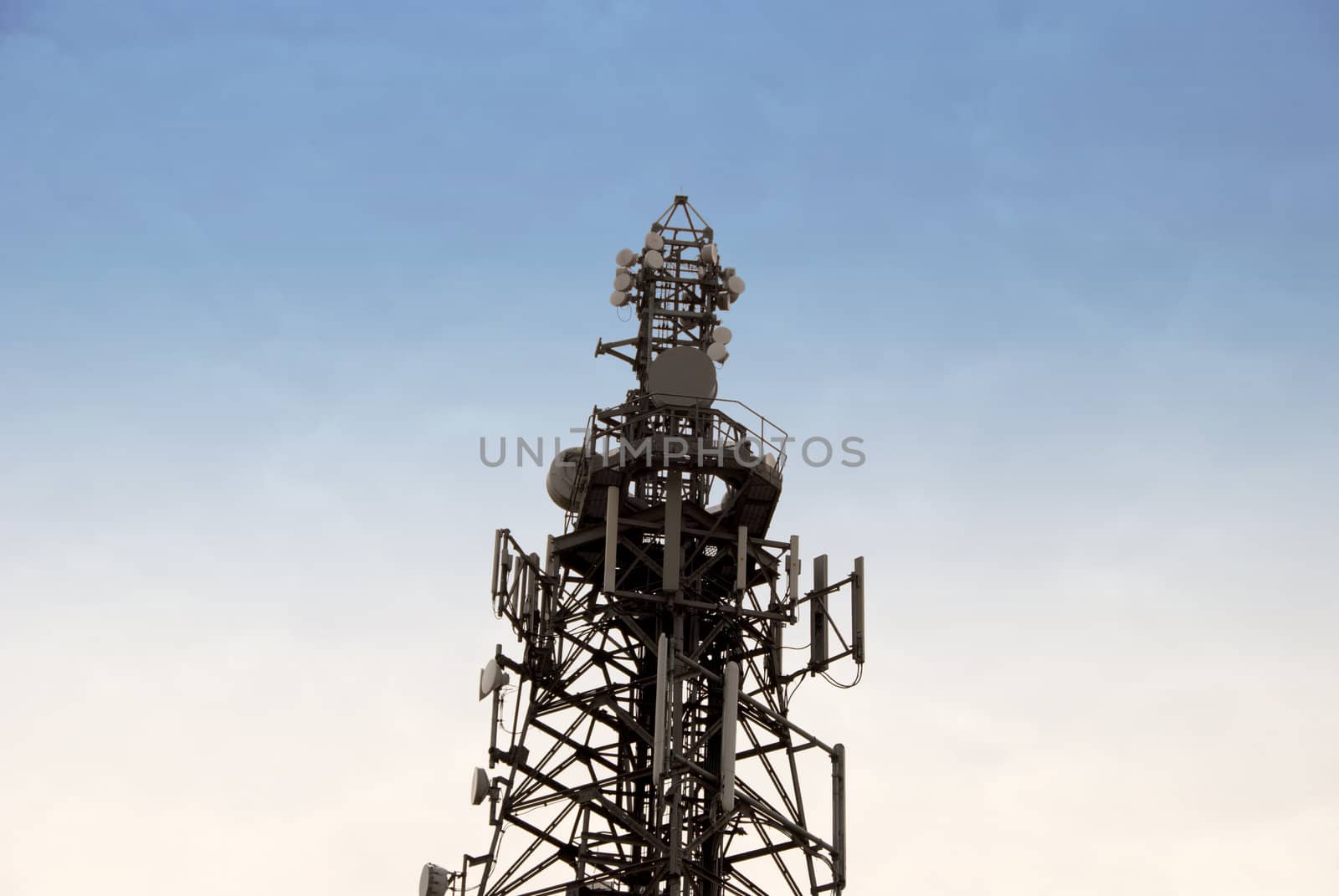 A Radio Mobile Phone Antenna against a blue sky