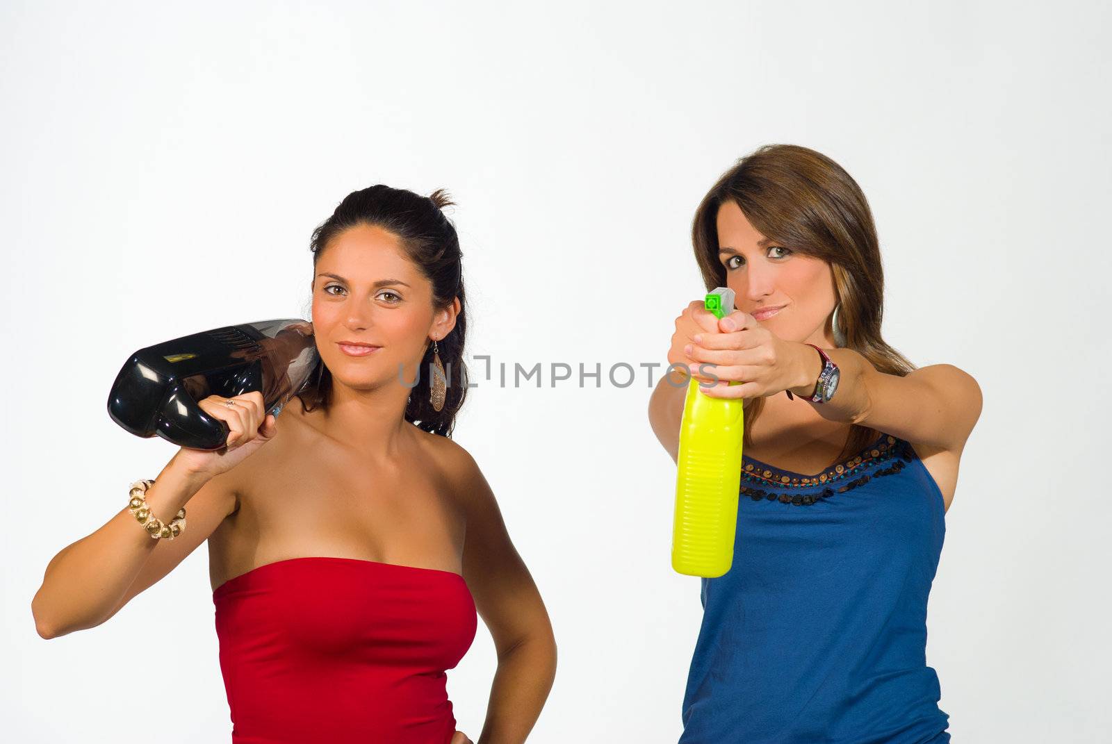 Two girls playing super agents with household equipment