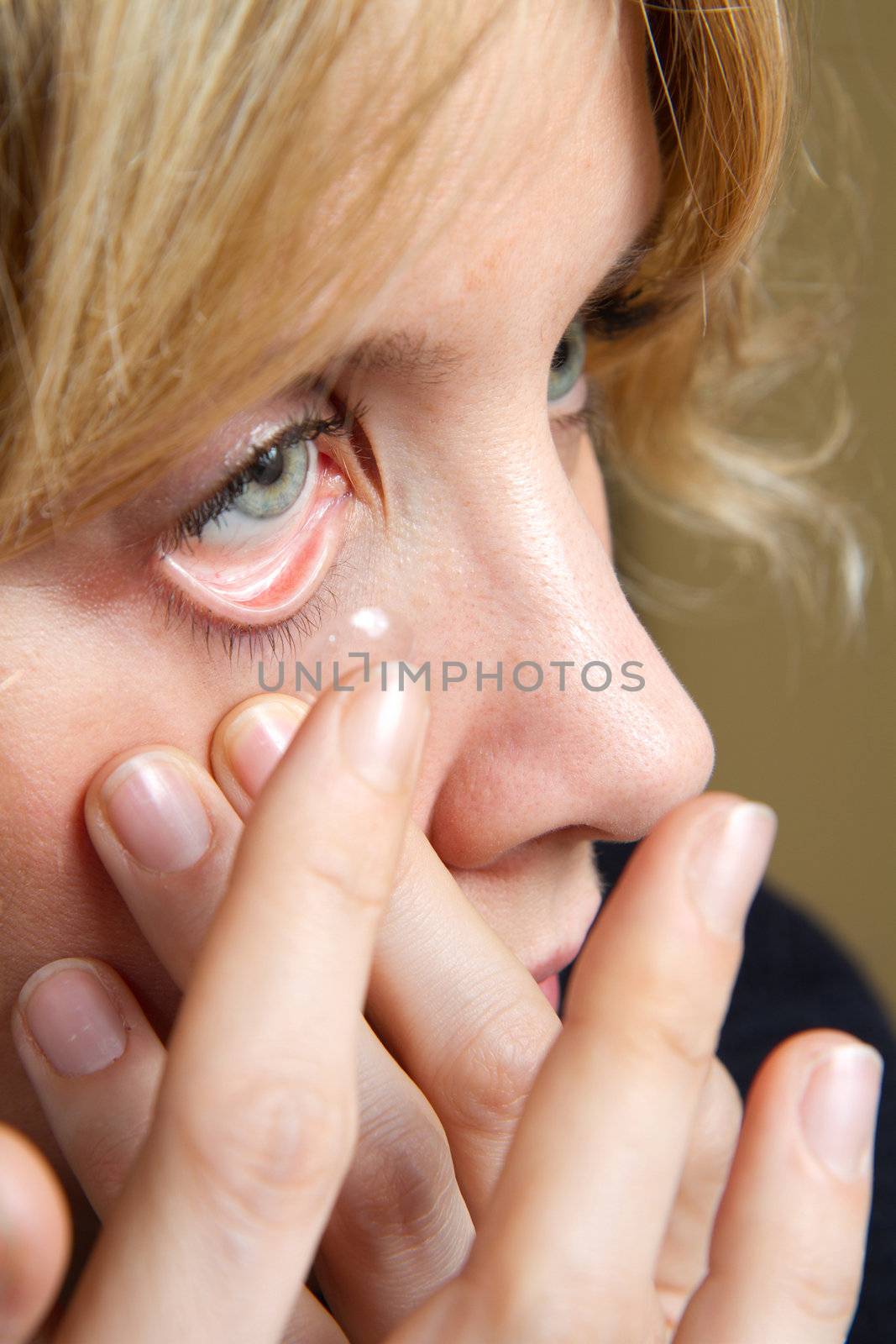 blonde girl with contact lens by lsantilli