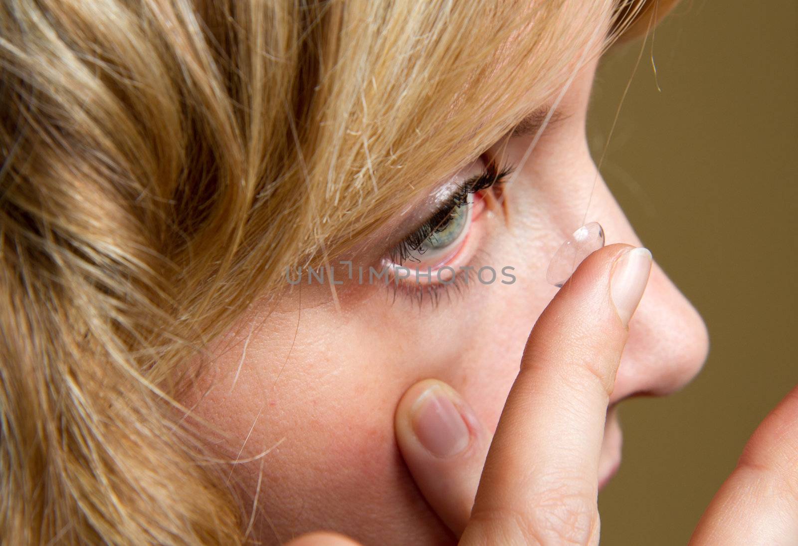 a blonde girl with contact lens